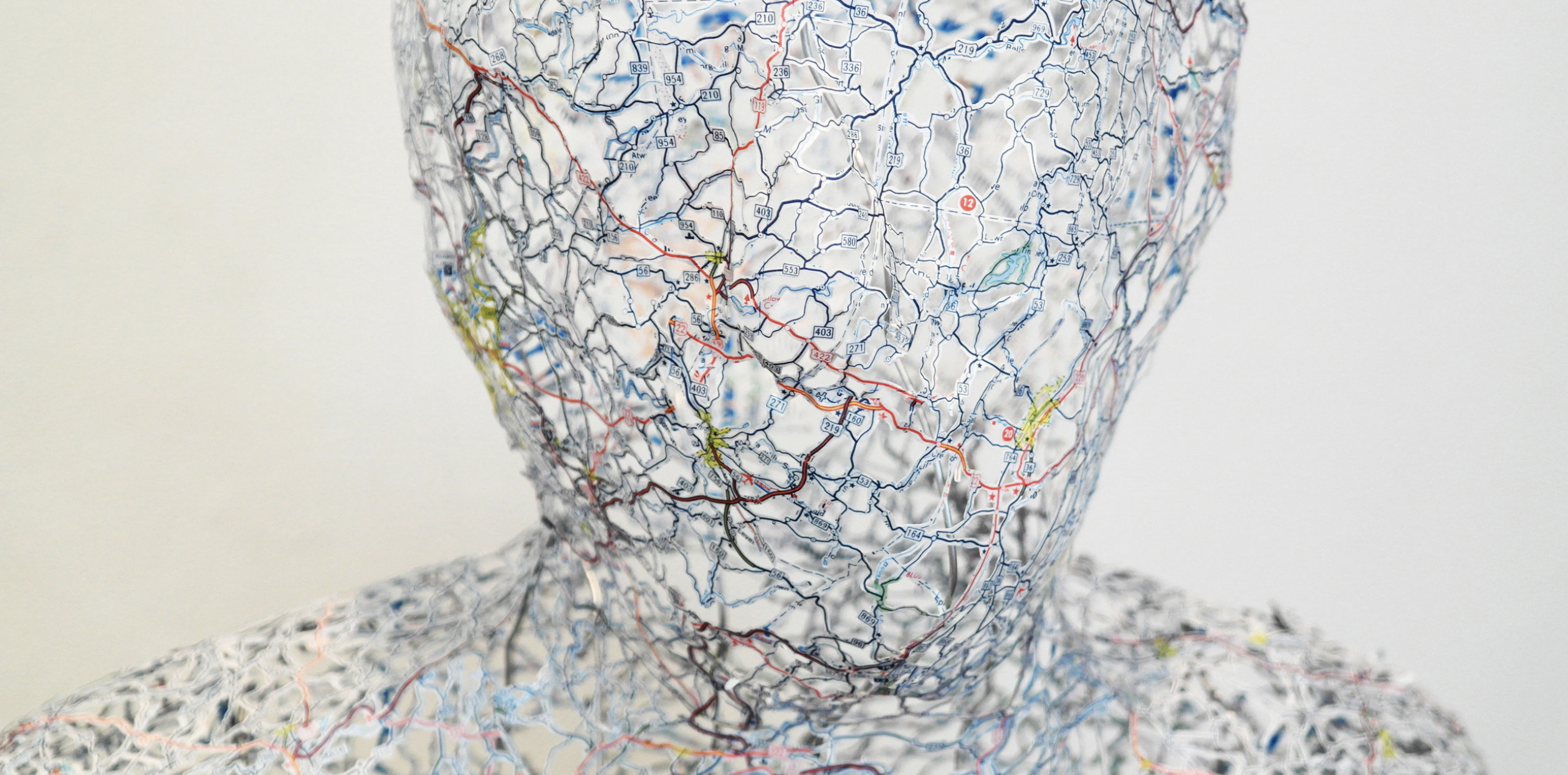 sculpture of a person made from a map by the artist nikki rosato